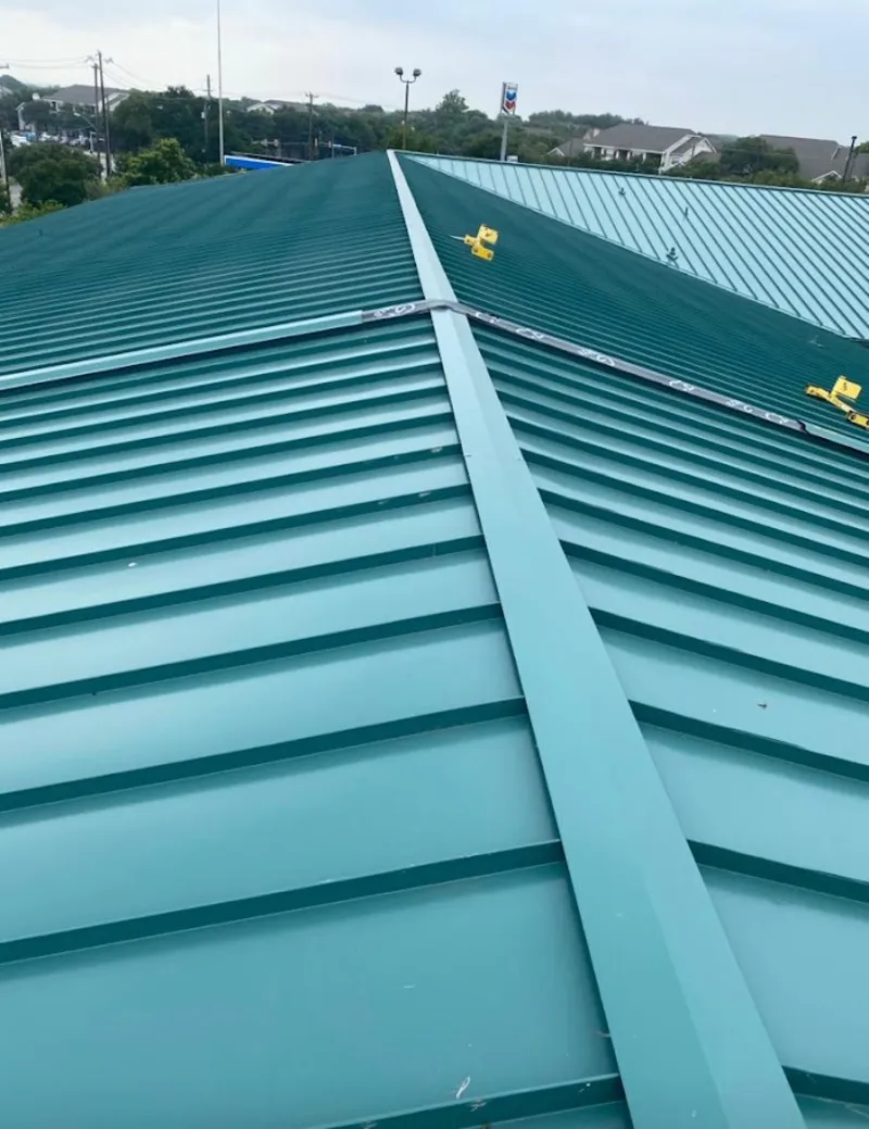 Green commercial metal roof ridge and valley for Metal Roof Repair in Camden